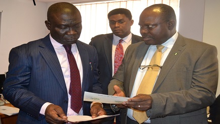 Senator Ike Ekweremadu, deputy senate president (DSP), receives his National Identification Number (NIN) from Barr. Chris ‘E Onyemenam, director general National Identity Management Commission (NIMC) after his enrolment at NIMC enrolment centre at the National Assembly Complex Abuja while a NIMC staff looks on.
