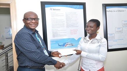 (L-r): Femi Collins, GM, human resources, Bristow Helicopters, presenting a cheque for N150,000 to Miss Temitope Coker, Winner, Tertiary Institutions Category, 5th Bristow Helicopters/Travel & Business News National Travel Essay Competition (NTEC 2013/14).