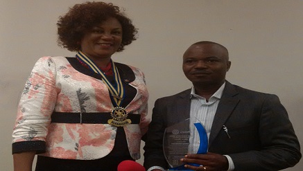 (L-r): Rotarian Dupe Ogunsanya, newly installed 2nd president, Rotary Club of FESTAC Central presenting an award to Lucky Uduikhue, managing director and chief executive officer, Data-Point Microsystems Limited, during the Club’s ceremony at the weekend.