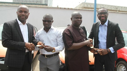 (L-r): Joseph Umunakwe‎, general manager, Microsoft Mobile Devices and Services, Winners in Microsoft#MakeItHappen Christmas Promo, Alli Oluwaseun with Ifeanyi Agilebu  and Olumide Balogun,‎ senior marketing manager, Microsoft Mobile Devices and Services,  at the official presentation of their car prize which took place on Tuesday at Microsoft Mobile Devices and Services Office in Lagos.