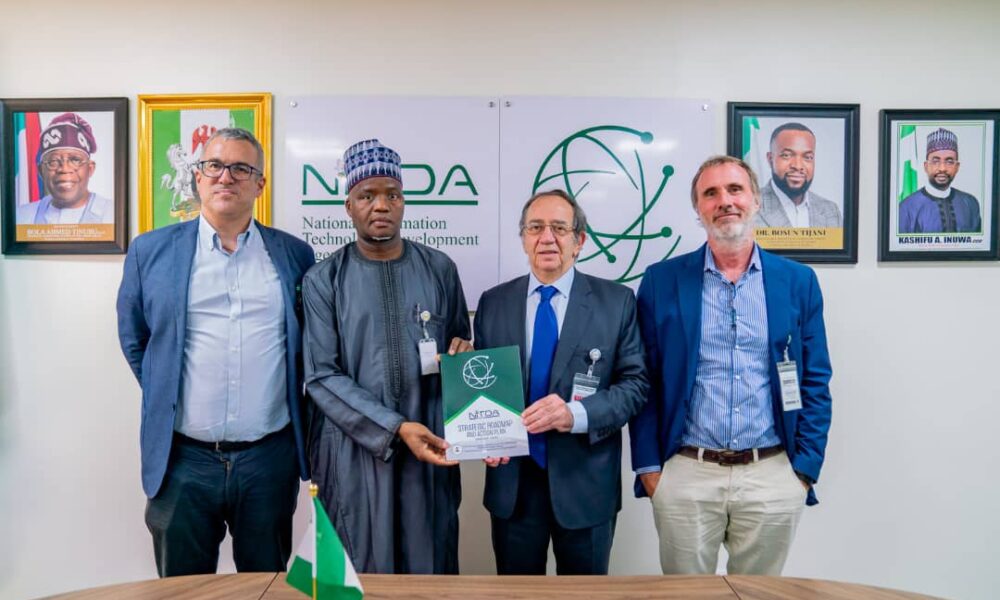 The Ambassador of Spain to Nigeria, Juan Sell, being presented with NITDA SRAP Documents by DG's Representative, Dr Usman Abdullahi Gambo, flanked by Reps of SEIDOR